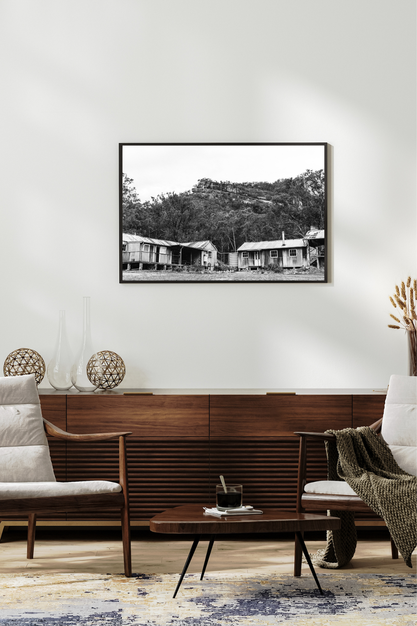 Emily O'Brien photographic print of a cozy cabin beneath snowy mountains, showcasing a serene mountain landscape scene.