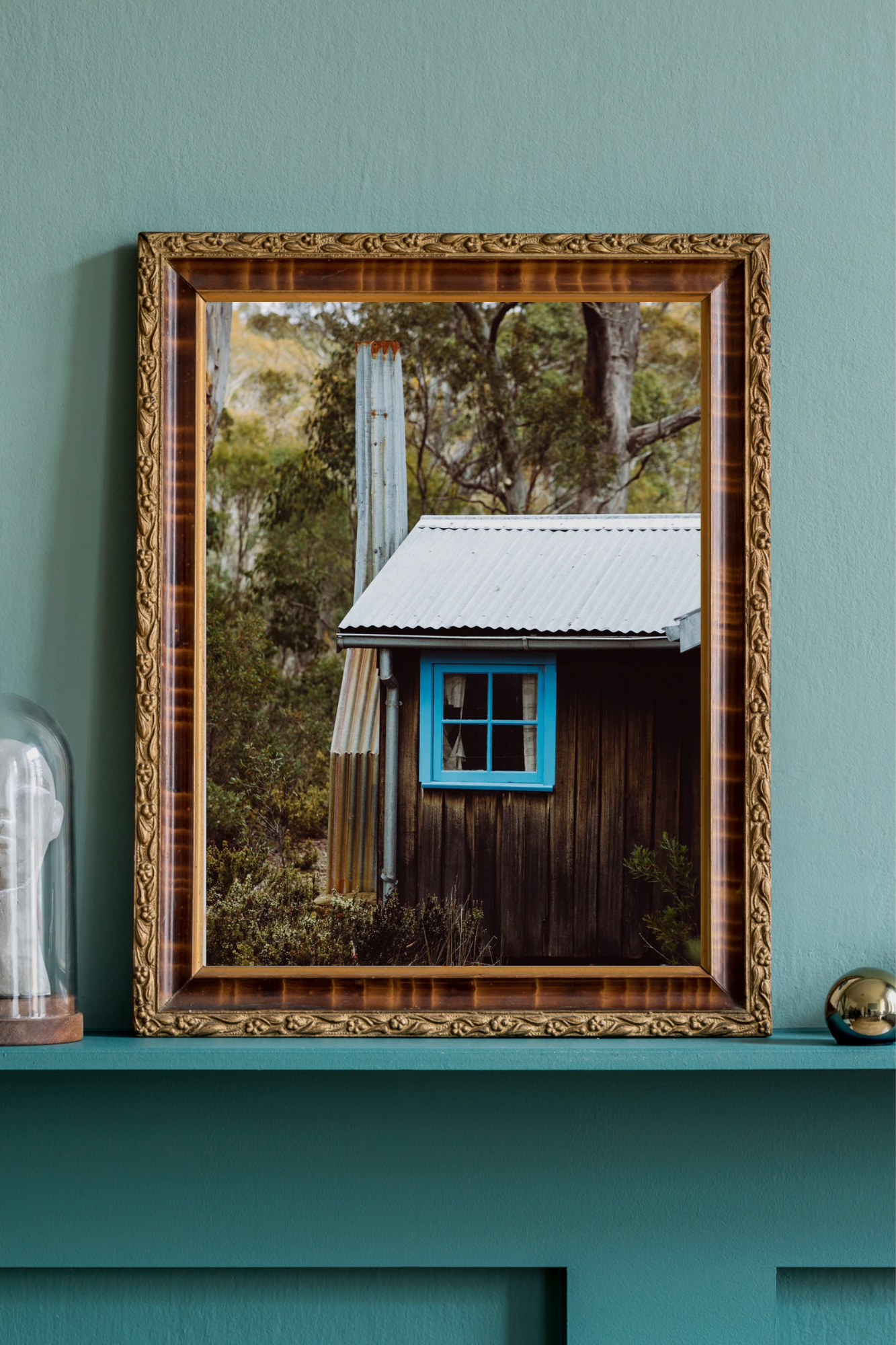 Emily O'Brien photographic print of a cozy cabin in the woods, showcasing detailed wood textures and serene natural scenery.